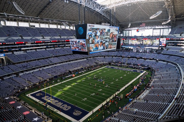 Players warm up on the field before the Chicago Bears play the Dallas Cowboys at AT&T Stadium Sunday Oct. 30, 2022, in Arlington, Texas. (Armando L. Sanchez/Chicago Tribune)
