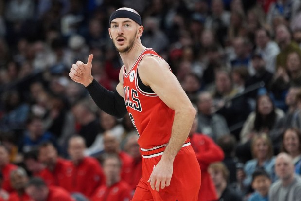 Bulls guard Alex Caruso gestures after making a 3-point shot during the first half against the Timberwolves on March 31, 2024, in Minneapolis. (AP Photo/Abbie Parr)