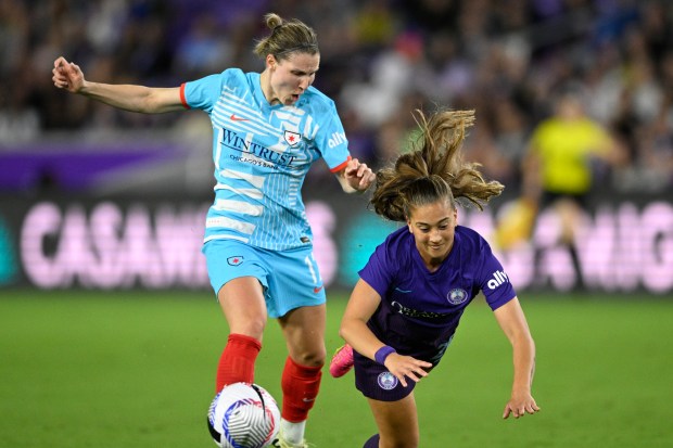 Chicago Red Stars defender Tierna Davidson, rear, and Orlando Pride forward Summer Yates compete for the ball on March 29, 2024, in Orlando, Fla. (AP Photo/Phelan M. Ebenhack)