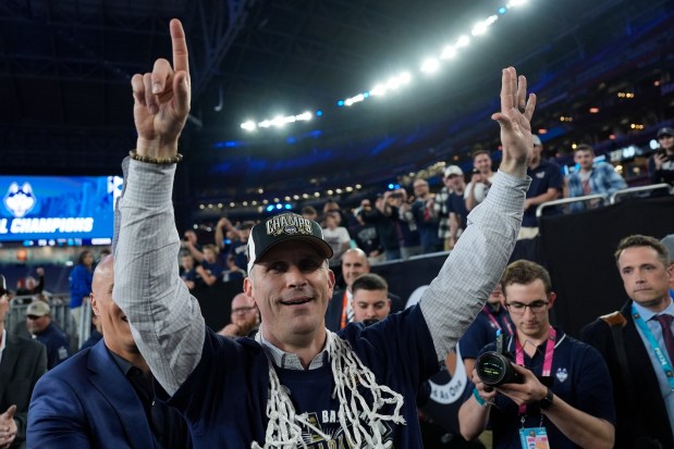 UConn coach Dan Hurley greets fans after their win against Purdue in championship game on April 8, 2024, in Glendale, Ariz. (AP Photo/David J. Phillip)