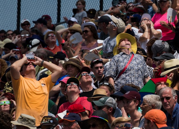 People observe the total solar eclipse at Saluki stadium at Southern Illinois University in Carbondale on Monday, August 21, 2017. (Zbigniew Bzdak/Chicago Tribune).