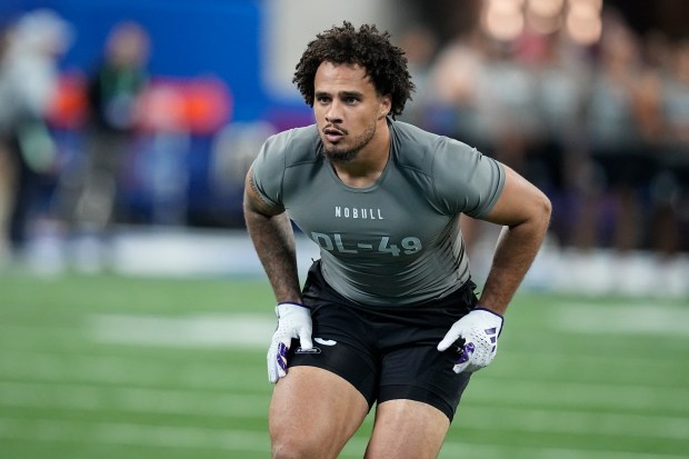 Washington defensive lineman Bralen Trice runs a drill at the NFL scouting combine on Feb. 29, 2024, in Indianapolis. (AP Photo/Darron Cummings)