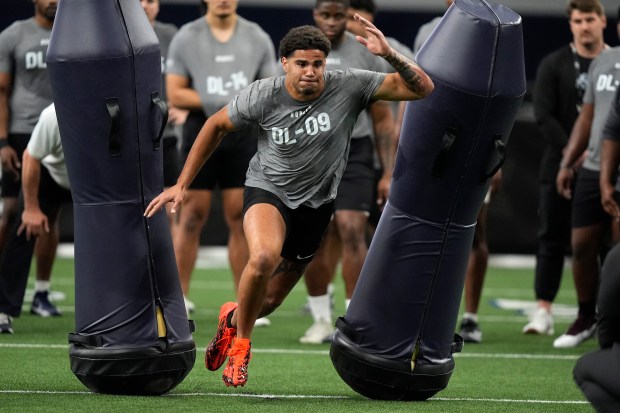 Kansas defensive lineman Austin Booker runs a drill during Big 12 pro day on March 30, 2024, in Frisco, Texas. (AP Photo/LM Otero)