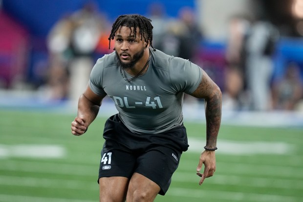 Western Michigan defensive lineman Marshawn Kneeland runs a drill at the NFL scouting combine on Feb. 29, 2024, in Indianapolis. (AP Photo/Darron Cummings)