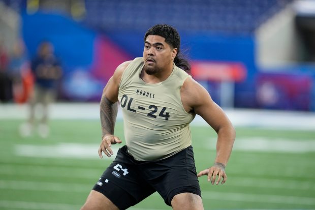 Oregon State offensive lineman Taliese Fuaga runs a drill at the NFL scouting combine on March 3, 2024, in Indianapolis. (AP Photo/Darron Cummings)