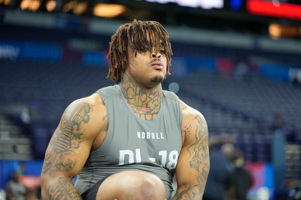 Texas defensive tackle Byron Murphy stretches before running a drill at the NFL scouting combine on Feb. 29, 2024, in Indianapolis. (AP Photo/Darron Cummings)