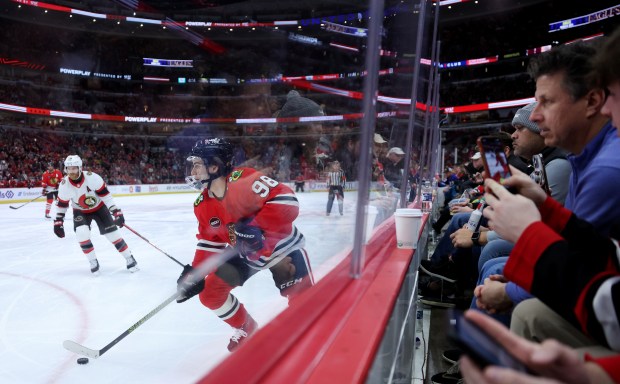 Blackhawks center Connor Bedard looks for an open teammate against the Senators on Feb. 17, 2024, at the United Center. (Chris Sweda/Chicago Tribune)