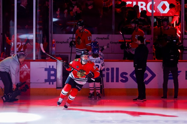 Blackhawks center Connor Bedard enters the rink before a game against the Penguins on Feb. 15, 2024, at the United Center. (Vincent Alban/Chicago Tribune)