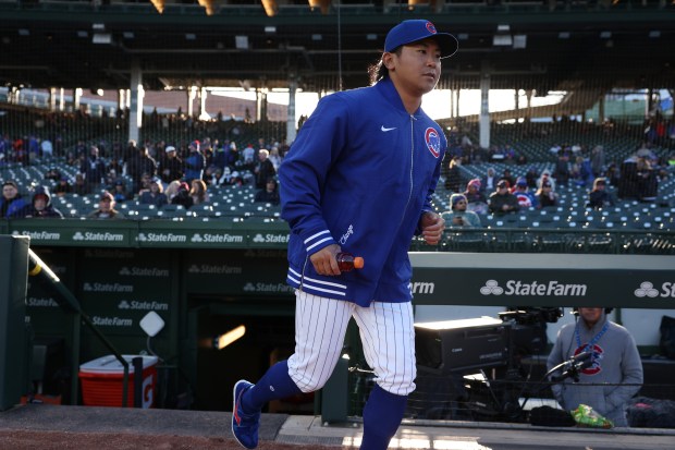 Cubs pitcher Shota Imanaga heads to the bullpen before a game against the Astros at Wrigley Field on April 24, 2024, in Chicago. (John J. Kim/Chicago Tribune)