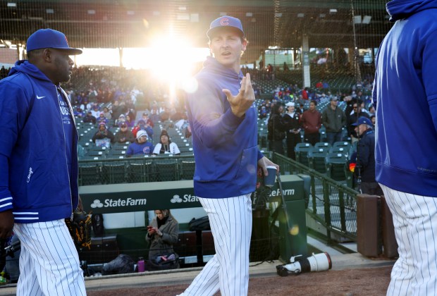 Cubs pitcher Hayden Wesneski, center, heads for the dugout before a game against the Astros at Wrigley Field on April 24, 2024, in Chicago. (John J. Kim/Chicago Tribune)