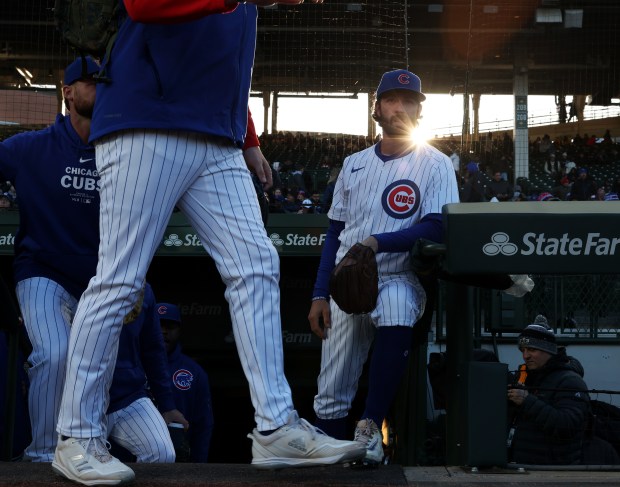 A sunbeam shines off of Cubs shortstop Dansby Swanson (7), right, before a game against the Astros at Wrigley Field on April 24, 2024, in Chicago. (John J. Kim/Chicago Tribune)