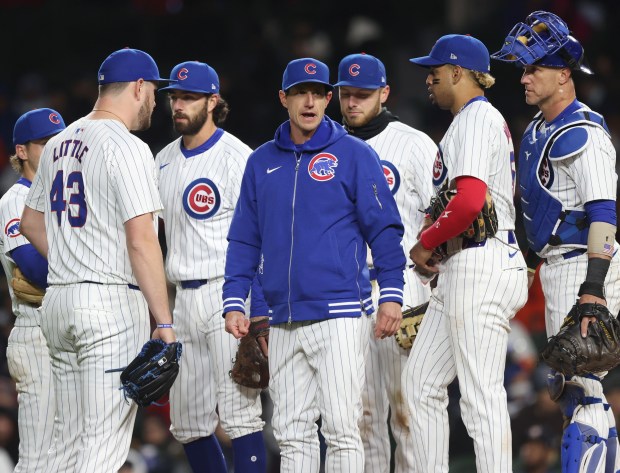 Cubs manager Craig Counsell, center, calls toward the dugout to get a replacement glove for pitcher Luke Little (43) in the seventh inning against the Astros at Wrigley Field on April 24, 2024, in Chicago. (John J. Kim/Chicago Tribune)