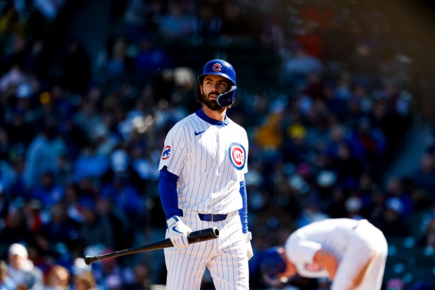 Cubs shortstop Dansby Swanson walks toward the dugout after striking out against the Marlins on April 19, 2024, at Wrigley Field. (Vincent Alban/Chicago Tribune)