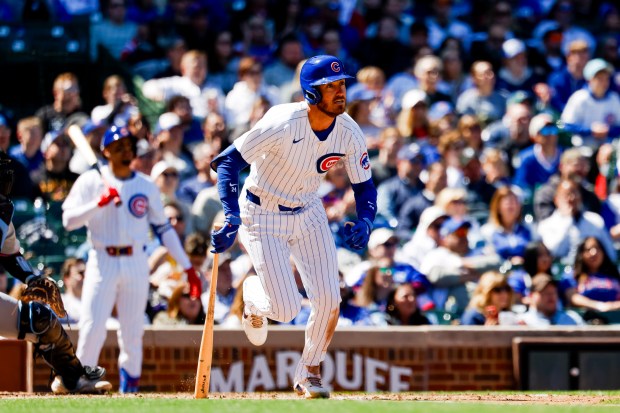 Cubs center fielder Cody Bellinger runs to first base after a hit against the Marlins on April 19, 2024, at Wrigley Field. (Vincent Alban/Chicago Tribune)