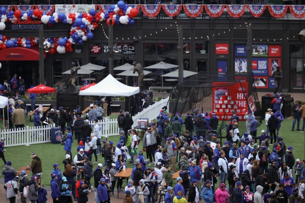 Chicago Cubs fans arrive to Gallagher Way before the game against the Colorado Rockies on Monday, April 1, 2024, in their home opener at Wrigley Field. (Brian Cassella/Chicago Tribune)