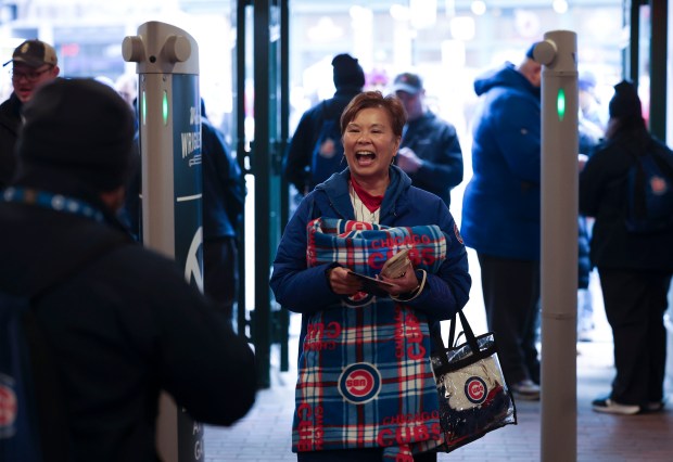 The first Chicago Cubs fans enter as the gates open before their game against the Colorado Rockies on April 1, 2024, in the home opener at Wrigley Field. (Brian Cassella/Chicago Tribune)