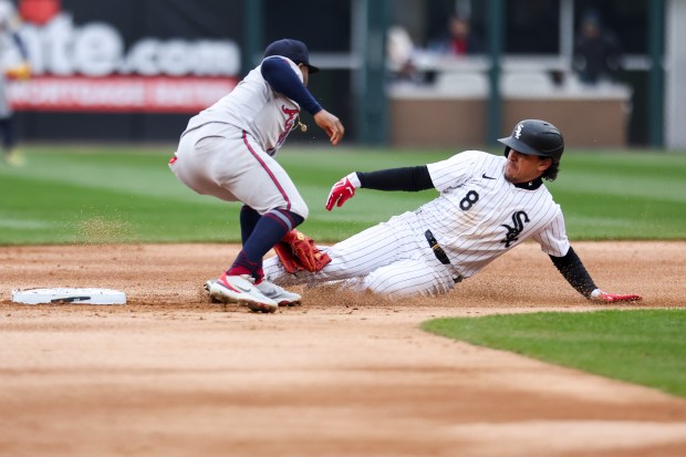 Atlanta Braves second baseman Ozzie Albies (1) tags Chicago White Sox second baseman Nicky Lopez (8) out as tries to steal second base during the second inning of the game at Guaranteed Rate Field in Chicago on April 1, 2024. (Eileen T. Meslar/Chicago Tribune)