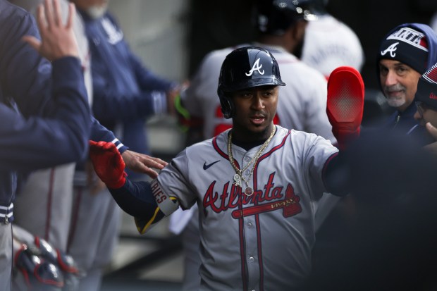 Atlanta Braves second baseman Ozzie Albies (1) celebrates with teammates after scoring during the sixth inning of the game against the Chicago White Sox at Guaranteed Rate Field in Chicago on April 1, 2024. (Eileen T. Meslar/Chicago Tribune)