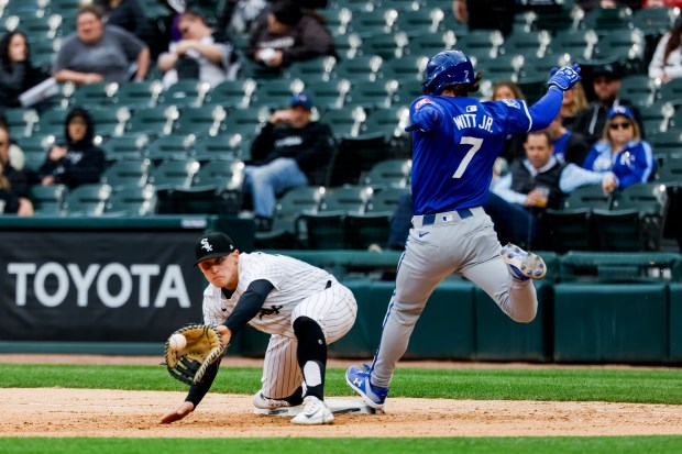 Chicago White Sox first base Andrew Vaughn (25) attempts to get Kansas City Royals shortstop Bobby Witt Jr. (7) out on first base during a game between the Chicago White Sox and the Kansas City Royals on Wednesday, April 17, 2024, at Guaranteed Rate Field in Chicago. (Vincent Alban/Chicago Tribune)