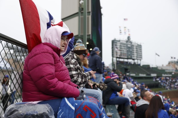 Rita Day waits in her bleacher seat before the Chicago Cubs home opener against the Colorado Rockies on April 1, 2024. (Vincent Alban/Chicago Tribune)