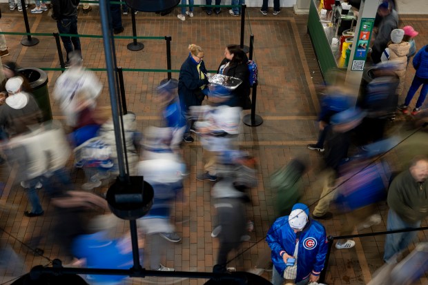 Fans walk through the stadium before the home opening day game between the Chicago Cubs and the Colorado Rockies on April 1, 2024, at Wrigley Field. (Vincent Alban/Chicago Tribune)