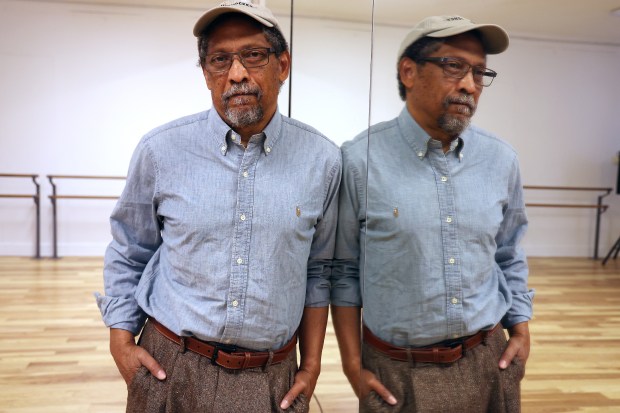 The novelist Percival Everett leans against a mirror in a studio in the Fine Arts Building on S. Michigan Avenue in Chicago before an event at the bookstore Exile in Bookville on Thursday, March 28, 2024. (Terrence Antonio James/Chicago Tribune)