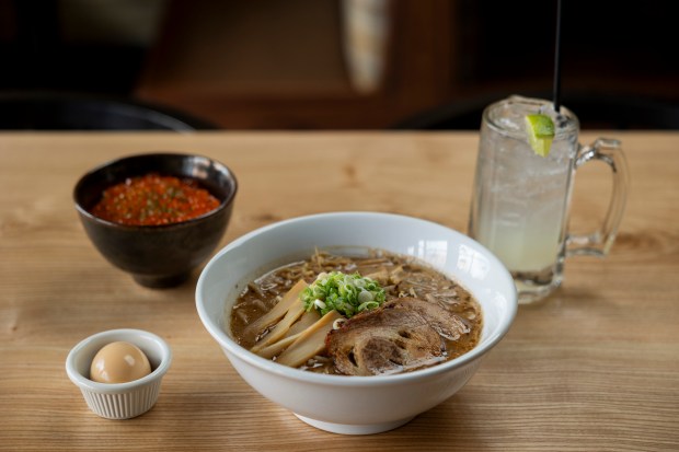 The ikura rice bowl, from left, ajitama egg on the side, Akahoshi miso ramen and yuzu highball cocktail at Akahoshi Ramen in Chicago on March 28, 2024. (Vincent Alban/Chicago Tribune)