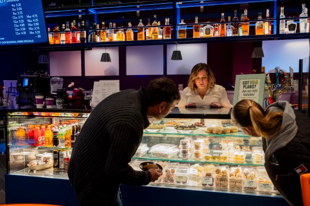 Beth Harris, a general manager, helps customers at the bakery counter at West Town Bakery in Wheeling. (Vincent Alban/Chicago Tribune)