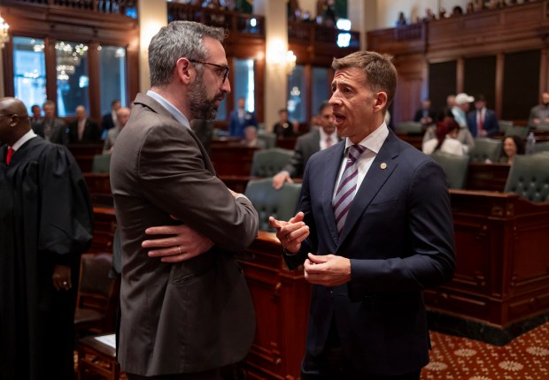 State Rep. Will Guzzardi, left, and Illinois Secretary of State Alexi Giannoulias speak before Gov. J.B. Pritzker delivered his State of the State and budget address at the Illinois State Capitol, Feb. 21, 2024. (Brian Cassella/Chicago Tribune/pool)