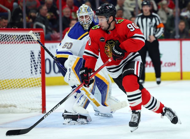 Chicago Blackhawks center Tyler Johnson (90) hustles after the puck in the first period on Dec. 9, 2023, at the United Center in Chicago. The Blackhawks beat the Blues 3-1. (Stacey Wescott/Chicago Tribune)