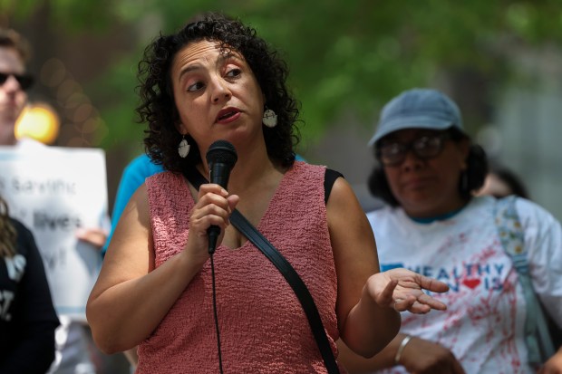 State Rep. Lilian Jiménez speaks during a migrant health care protest, June 21, 2023, at Federal Plaza in Chicago. (Shanna Madison/Chicago Tribune)