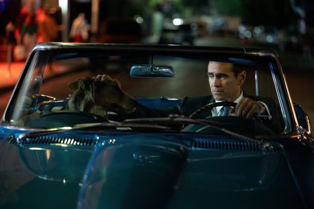 L.A. detective John Sugar (Colin Farrell) tools around some mean streets with his dog, Wiley, in "Sugar." (Jason LaVeris/Apple TV+)