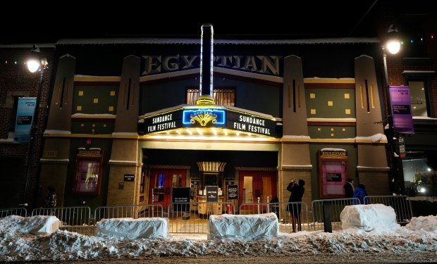 A man takes a picture of the marquee of the Egyptian Theatre before the Sundance Film Festival on Jan. 17, 2024, in Park City, Utah. (Chris Pizzello/AP)