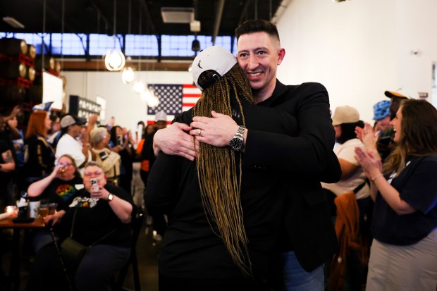 Chicago Sky General Manager Jeff Pagliocc hugs Head Coach Teresa Weatherspoon during Chicago Sky's WNBA draft watch party at Revolution Brewing in Chicago on April 15, 2024. (Eileen T. Meslar/Chicago Tribune)