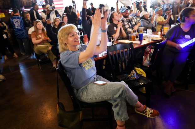 Ashley Durkin-Rixey celebrates after Kamilla Cardoso was picked third in the draft by the Chicago Sky during Chicago Sky's WNBA draft watch party at Revolution Brewing in Chicago on April 15, 2024. (Eileen T. Meslar/Chicago Tribune)