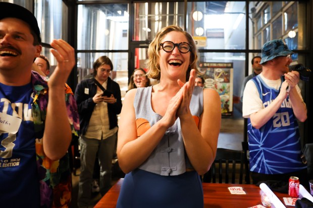 Cate Kompare celebrates Chicago Sky's seventh overall pick, Angel Reese, during Chicago Sky's WNBA draft watch party at Revolution Brewing in Chicago on April 15, 2024. (Eileen T. Meslar/Chicago Tribune)
