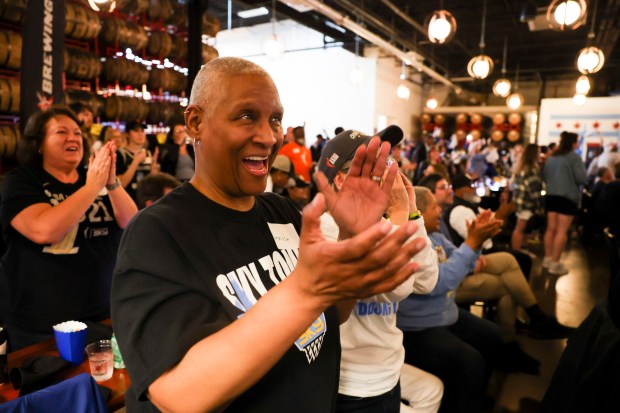 Denise Coleman celebrates Chicago Sky's seventh overall pick, Angel Reese, during Chicago Sky's WNBA draft watch party at Revolution Brewing in Chicago on April 15, 2024. (Eileen T. Meslar/Chicago Tribune)