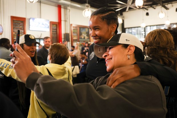 Chicago Sky Coach Tamera "Ty" Young pose for a photo with Michelle Redmond during Chicago Sky's WNBA draft watch party at Revolution Brewing in Chicago on April 15, 2024. (Eileen T. Meslar/Chicago Tribune)
