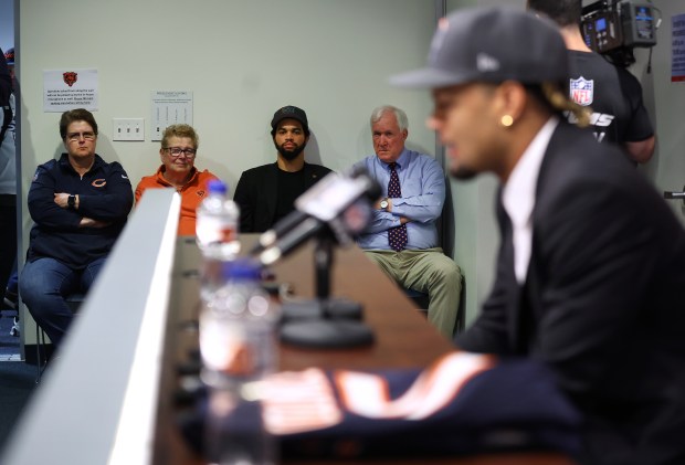 New Chicago Bears quarterback Caleb Williams (center) listens in as new wide receiver Rome Odunze speaks at Halas Hall in Lake Forest on Friday, April 26, 2024. Williams was picked number one overall and Odunze was picked number nine overall in the 2024 NFL Draft. (Chris Sweda/Chicago Tribune)