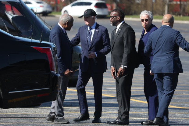 President Joe Biden, wearing cap, arrives at Soldier Field in Chicago on Monday, April 8, 2024, in advance of a fundraising event. He is greeted by U.S. Rep. Danny Davis, from left, Chicago Mayor Brandon Johnson and Cook County Board President Toni Preckwinkle. (Terrence Antonio James/Chicago Tribune)
