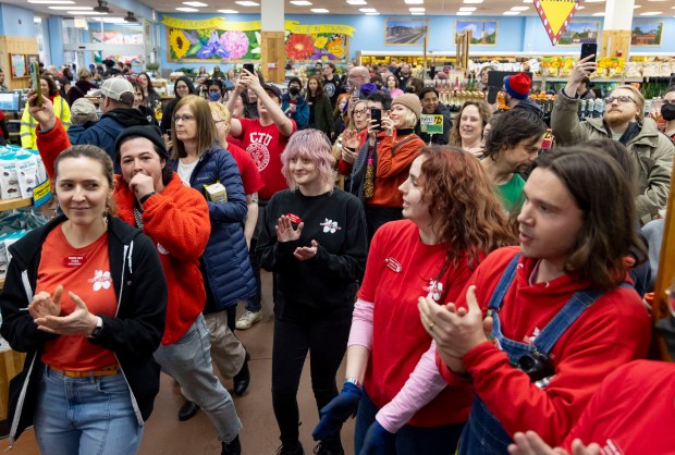 Trader Joe's workers and supporters cheer as they announce they're filing for a union election, April 7, 2024, in North Center. (Brian Cassella/Chicago Tribune)
