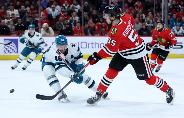 Chicago Blackhawks defenseman Kevin Korchinski (55) takes a shot in the first period of a game against the San Jose Sharks at the United Center in Chicago on Jan. 16, 2024. (Chris Sweda/Chicago Tribune)