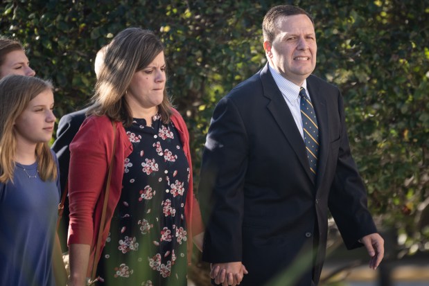 Former Portage Mayor James Snyder arrives for his sentencing with his family at the federal courthouse in Hammond, Indiana, on Oct. 13, 2021. (Kyle Telechan / for the Post-Tribune)