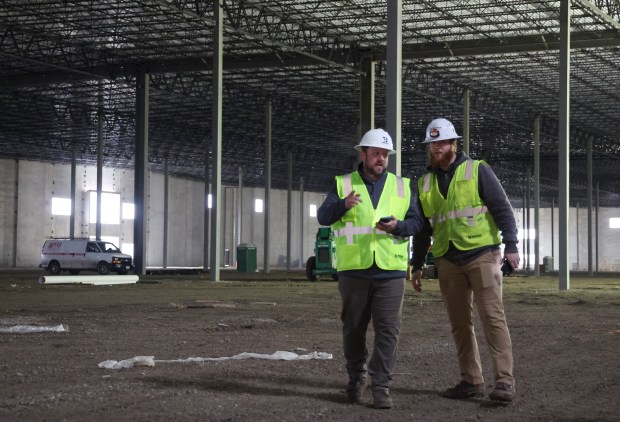 Jonathan and David Nelsen, with Premier Design & Build Group, stand in building 3 on the new Dermody logistics campus on April 2, 2024, in Glenview. The building is being built on the site of the former Allstate headquarters. (Stacey Wescott/Chicago Tribune)