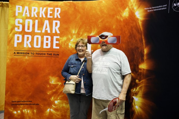 SIU Alum, David Ely, of Kankakee, right, stands with his wife, Jan Ely, to pose for a picture during the Crossroads Astronomy, Science and Technology Expo at Southern Illinois University in Carbondale on April 7, 2024.(Eileen T. Meslar/Chicago Tribune)