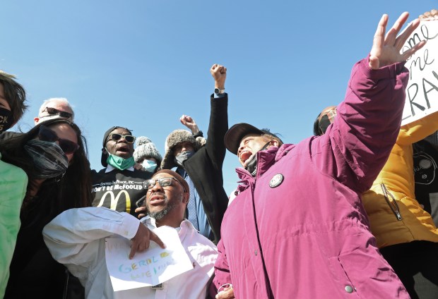 Gerald Reed, center left, and his mother, Armanda Shackelford, yell out after Reed is released from Stateville Correctional Center, April 2, 2021, in Crest Hill. Gov. J.B. Pritzker commuted Reed's sentence after spending 30 years of a life sentence for allegedly being tortured into confession for a double murder under the direction of former Chicago police Cmdr. Jon Burge. (John J. Kim/Chicago Tribune)