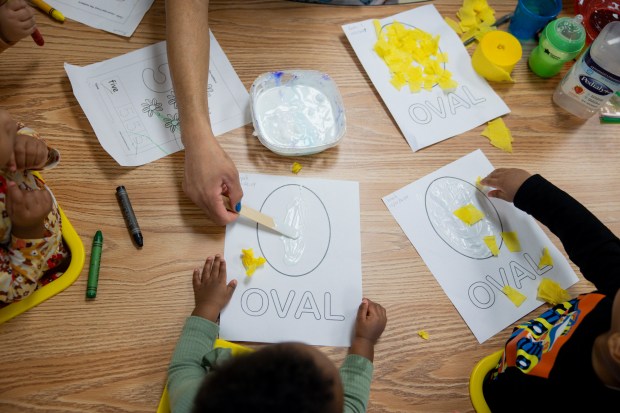 Children work on arts and crafts together on March 5, 2024, at the Blanche Foxworthy Infant Care Center. (Vincent Alban/Chicago Tribune)