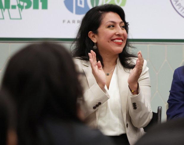 Sendy Soto, Chicago's first chief homelessness officer, listens to speakers at the grand opening of the Lawson House, a building with newly renovated affordable housing units in the Gold Coast, on April 1, 2024, in Chicago. (Stacey Wescott/Chicago Tribune)