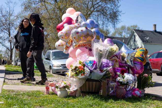 A memorial grows on April 15, 2024, on the sidewalk where Ariana Molina, 9, was shot and killed Saturday evening during a family celebration in front of their home in the 2000 block of West 52nd Street. (Brian Cassella/Chicago Tribune)