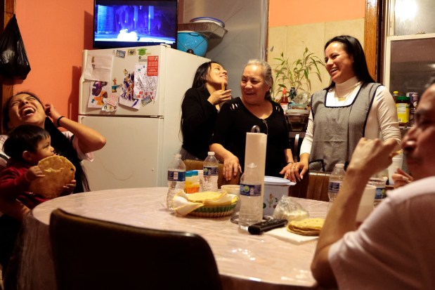 Several family members arrive at the home of Claudia Perez to wish her goodbye, Feb. 18, 2024, as she prepares to leave for Mexico. At right is her daughter Elizeth. (Antonio Perez/ Chicago Tribune)